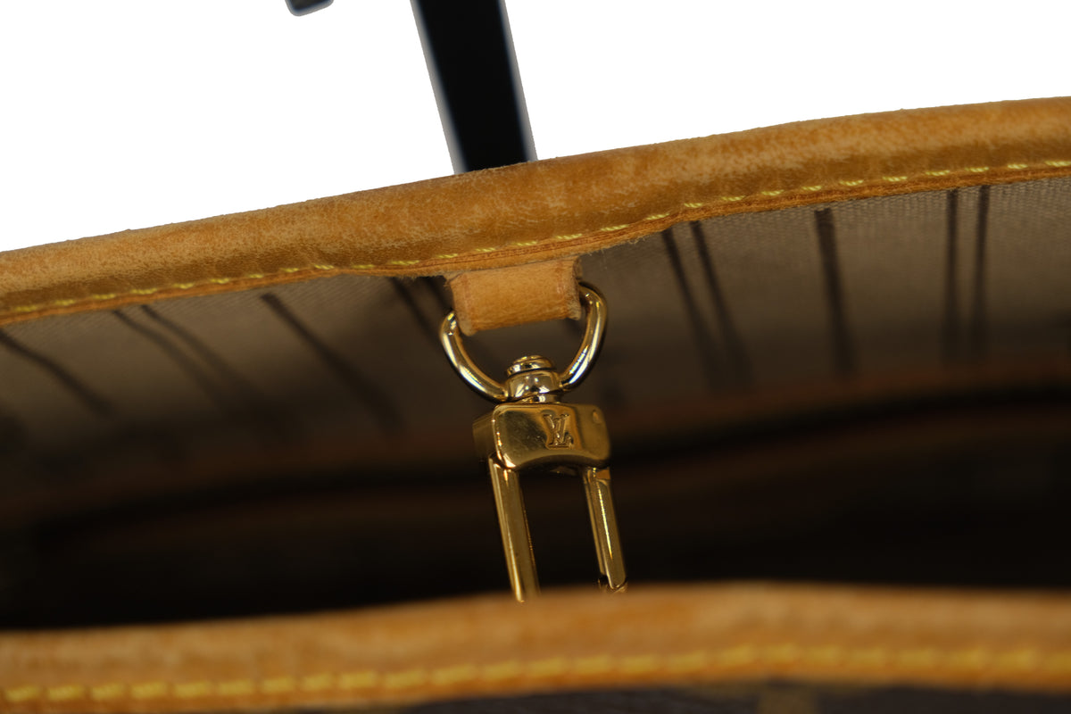 Side profile of the Louis Vuitton Neverfull PM tote bag