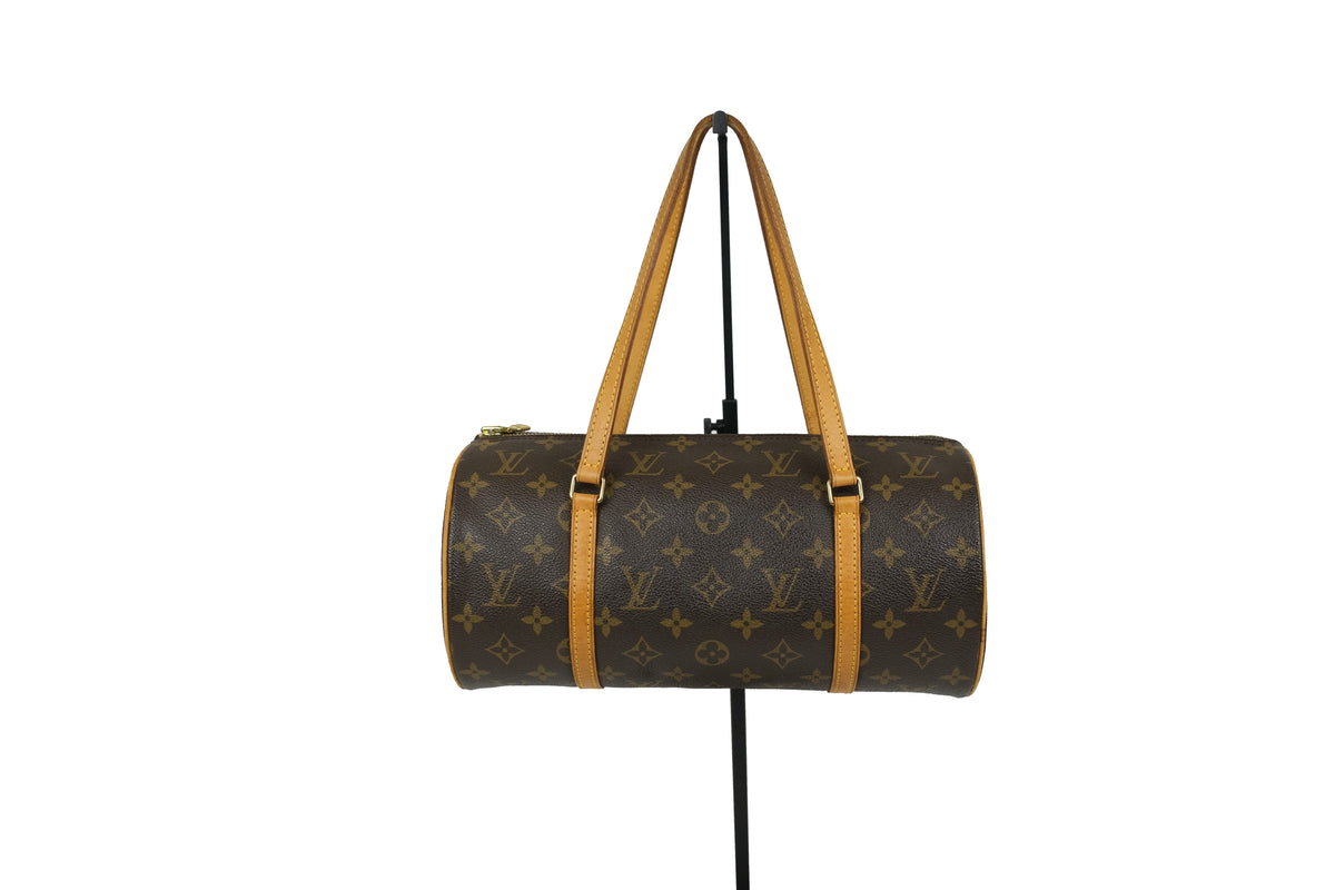 End view showing the round shape of the Louis Vuitton Monogram Papillon 30 handbag