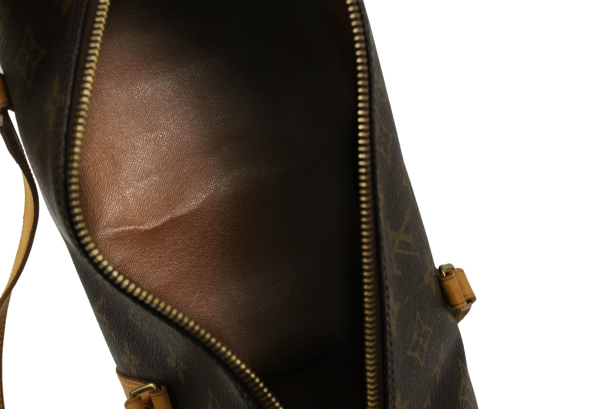 Close-up of the Monogram canvas and tan leather strap on the Louis Vuitton Papillon 30