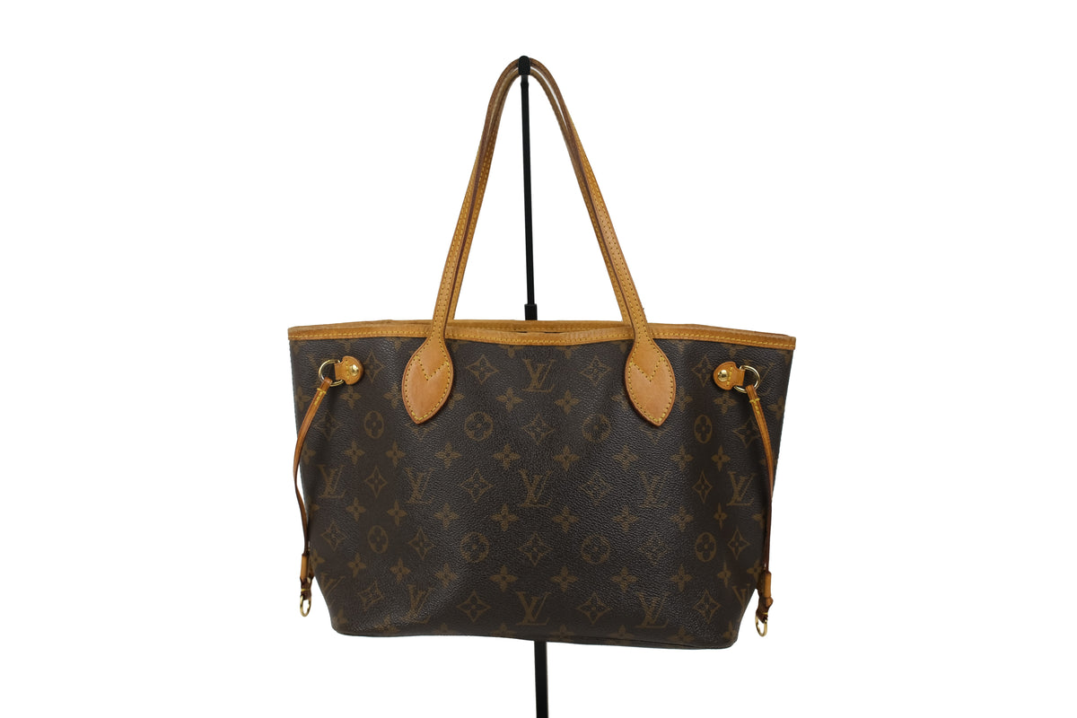 Bottom of the brown Louis Vuitton Monogram Neverfull PM tote bag
