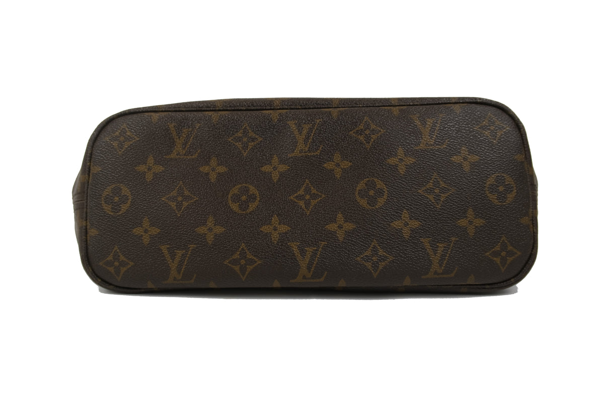 Close-up of the tan leather handles and top trim on the Louis Vuitton Neverfull PM