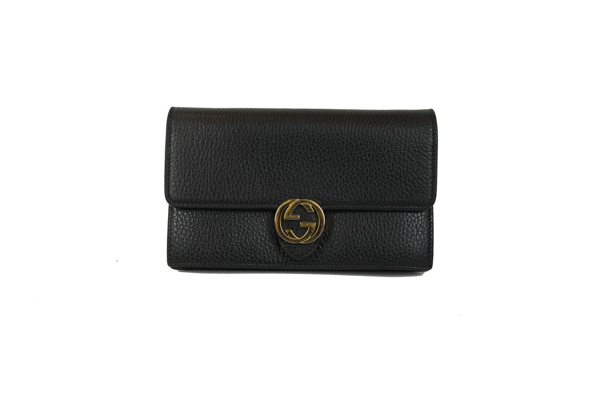 Interior of the black Gucci Interlocking G chain wallet showing card slots and zip compartment