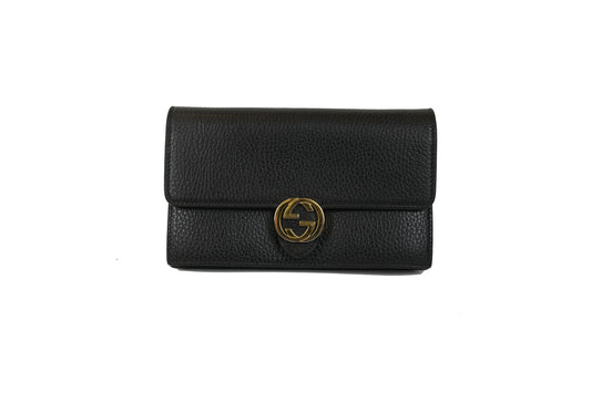 Interior of the black Gucci Interlocking G chain wallet showing card slots and zip compartment