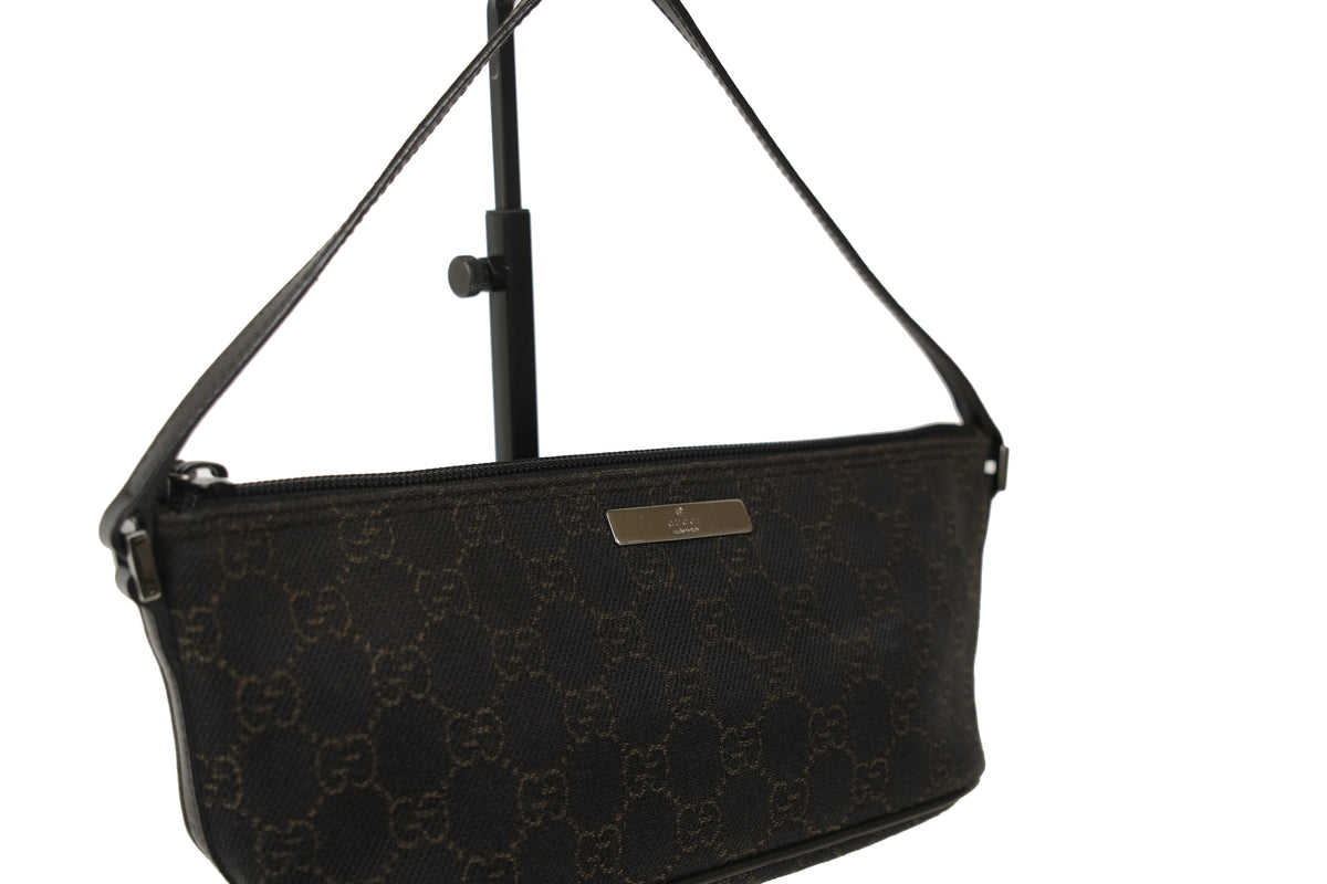 Angled view of the Gucci Boat Pochette shoulder bag and strap