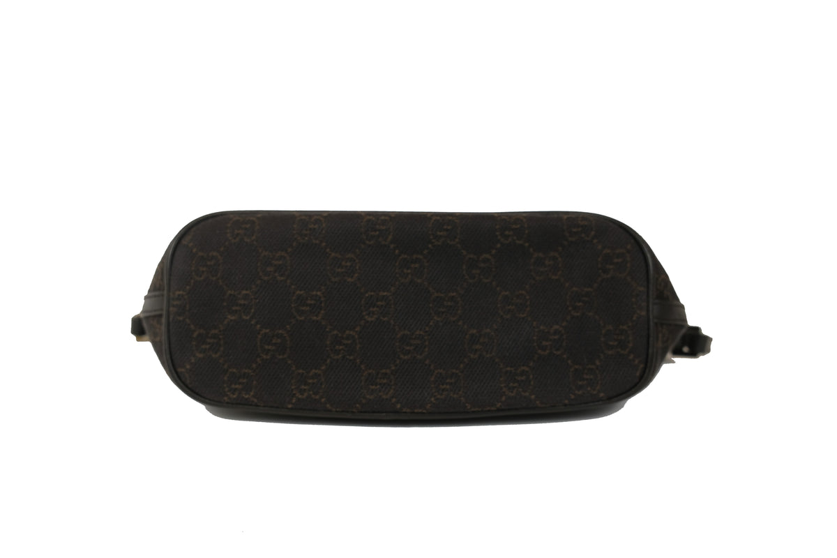 Close-up of the Gucci plaque on the front of the Boat Pochette